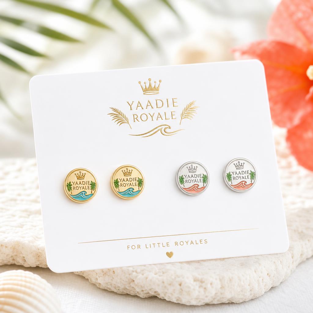 Yaadie Royale kids' crest stud earrings on a branded card