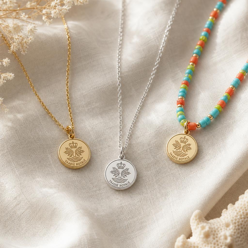 Yaadie Royale fine gold and silver chains and a beaded necklace with crest charms