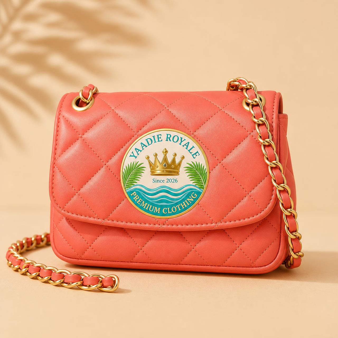 Yaadie Royale coral quilted shoulder bag with the crest logo